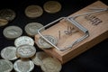 Mouse Trap Catches a British Pound Coin Royalty Free Stock Photo