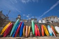 Mousehole beach and village with colourful kayaks