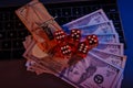 Mousetrap on dollar banknotes and casino dices close-up. Onine gambling addiction