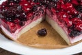 Mousse cake with berries on wooden background Royalty Free Stock Photo