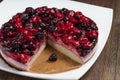 Mousse cake with berries on wooden background Royalty Free Stock Photo