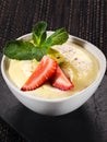 Mousse dessert in bowl, whipped cream with strawberry