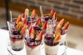 Mousses with red berries on the dessert table for a party - Fragaria Royalty Free Stock Photo