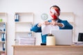 Mouth and eyes closed male employee working in the office Royalty Free Stock Photo