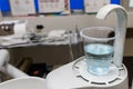 Mouth rinse containing water and antiseptic in dental clinic surgery room