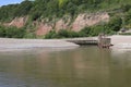 The mouth of the river Axe as it meets the sea at Axmouth in Devon. It is quite narrow and becomes a raging torrent when the tide Royalty Free Stock Photo