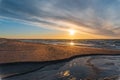 mouth of a stream, sunset at sea Royalty Free Stock Photo