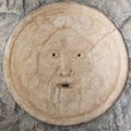 Mouth of truth sightseeing in Rome, Italy. Historical sculpture made of marble, antique face full of mystery and legend