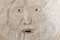 Mouth of truth sightseeing in Rome, Italy. Historical sculpture made of marble, antique face full of mystery and legend