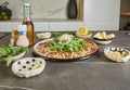 Mouth watering carpaccio made with fresh, high-quality ingredients laid out on a sleek black marble countertop