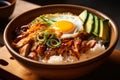 mouth-watering chicken teriyaki donburi bowl with sliced avocado, pickled ginger, and a sunny-side-up egg on top