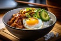 mouth-watering chicken teriyaki donburi bowl with sliced avocado, pickled ginger, and a sunny-side-up egg on top