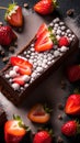 A mouth-watering image of a chocolate cake with fresh strawberries on top, sprinkled with powdered sugar