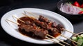 Satay with chili sauce on white plate on black background. Generative AI.