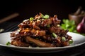 A plate of sticky pork ribs glazed