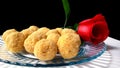 Mouth watering sweet - Besan laddoo made by roasted gram flour, ghee, dry fruits and sugar, served in a plate