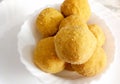 A mouth watering sweet - Besan laddoo made by roasted gram flour, ghee, dry fruits and sugar