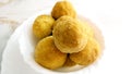 A mouth watering sweet - Besan laddoo made by roasted gram flour, ghee, dry fruits and sugar