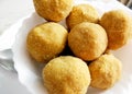 A mouth watering sweet - Besan laddoo made by roasted gram flour, ghee, dry fruits and sugar