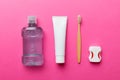 Mouthwash and other oral hygiene products on colored table top view with copy space. Flat lay. Dental hygiene. Oral care Royalty Free Stock Photo