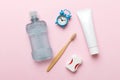 Mouthwash and other oral hygiene products on colored table top view with copy space. Flat lay. Dental hygiene. Oral care Royalty Free Stock Photo