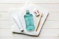 Mouthwash and other oral hygiene products on colored table top view with copy space. Flat lay. Dental hygiene. Oral care Royalty Free Stock Photo