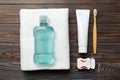 Mouthwash and other oral hygiene products on colored table top view with copy space. Flat lay. Dental hygiene. Oral care Royalty Free Stock Photo