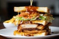 mouthwatering close-up of a club sandwich layered with crispy chicken tenders, tangy coleslaw, and sweet barbecue sauce Royalty Free Stock Photo