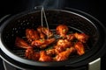 A mouthwatering close-up shot showcasing juicy and flavorful chicken wings expertly grilled to perfection, Frying BBQ chicken