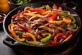 A mouthwatering dish featuring a variety of meat, peppers, and onions cooked to perfection in a skillet, Sizzling fajitas with