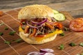 Mouthwatering double burger on a bamboo board