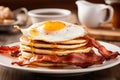 A mouthwatering photograph of a stack of pancakes, served with crispy bacon and a perfectly cooked egg, A morning breakfast with