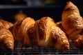 Golden Croissant Stack: Delectable, Buttery, Flaky Layers Cooling on Wire Rack