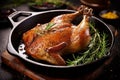 Mouthwatering roast goose with crispy golden skin, cooked to perfection in a sizzling pan