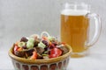 Mouthwatering salad and a glass of beer