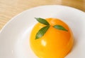 Mouthwatering Mandarin Orange Dome Cake on a White Plate