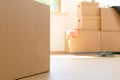 Move. Cardboard boxes for moving into a new, clean home. In a sunny day by a window in attic Royalty Free Stock Photo