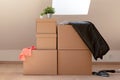 Move. Cardboard boxes for moving into a new, clean home. In a sunny day by a window in attic Royalty Free Stock Photo