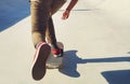 Always move at your own speed in life. an unrecognizable man doing tricks on his skateboard at a skate park.