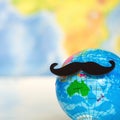 Movember beard word sign world map background