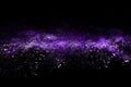 Purple powder explosion on black background. Royalty Free Stock Photo