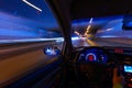 Movement of the car at night on the country highway at a high speed of viewing from the inside with the driver. Hand on Royalty Free Stock Photo
