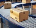 Movement of cardboard boxes on a conveyor belt inside a modern warehouse during daylight hours Royalty Free Stock Photo