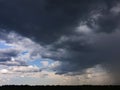 the movement of clouds over an agricultural field with wheat Royalty Free Stock Photo