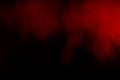 Movement of colorful smoke.Abstract red smoke on black background. Royalty Free Stock Photo