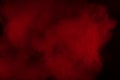 Movement of colorful smoke.Abstract red smoke on black background. Royalty Free Stock Photo
