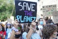 Young protesters holding placards during the climate strike march