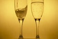 Movement of poring alcohol drinking in couple golden champagne glasses for luxury Christmas celebration party background Royalty Free Stock Photo