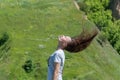 Movement raise on head hair up in the air. Portrait carefree woman.