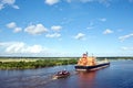 The movement of sea merchant ships and tugs to the entrance and exit from the port. Beaumont, Texas Royalty Free Stock Photo